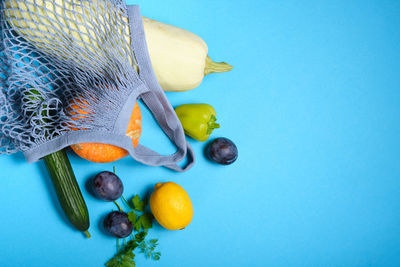 High angle view of oranges against blue background