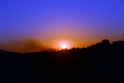 Scenic view of silhouette landscape against romantic sky at sunset