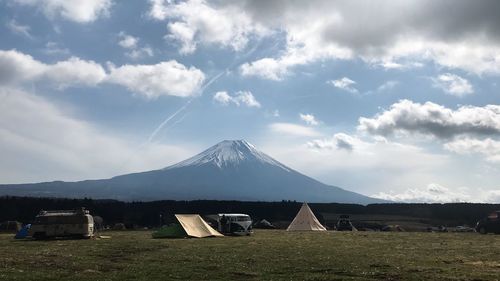 Tent on field against sky