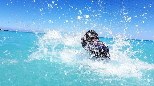 Man swimming in pool