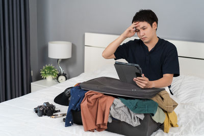 Young woman using laptop at home