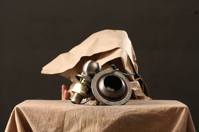Close-up of camera on table against black background