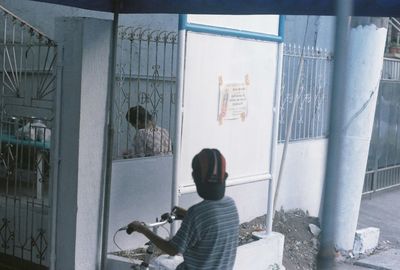 Woman standing against wall