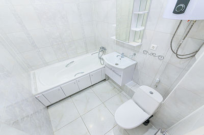 Interior apartment room bathroom, sink, decorative elements, toilet