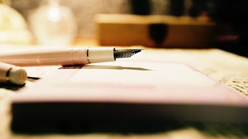 Close-up of pen on table