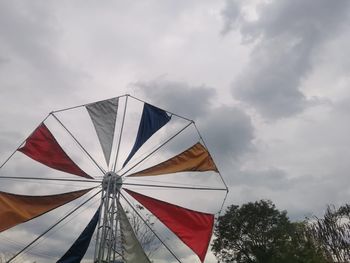 Low angle view of parasol against sky