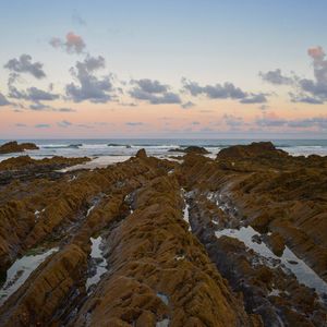 Scenic view of sea against sky at sunset