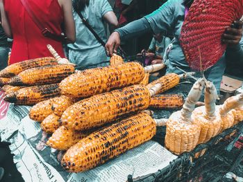 Man preparing food for sale at market stall