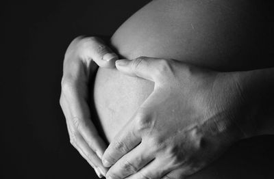 Close-up of hand holding baby