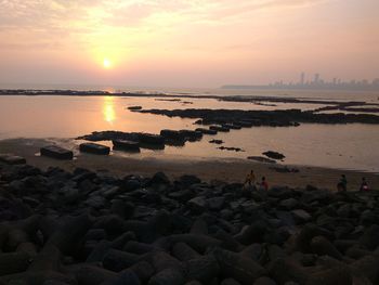 Scenic view of sea against sky during sunset