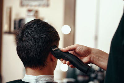 Close-up of man using mobile phone