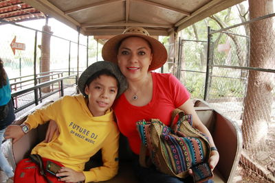 Portrait of mother and son in train