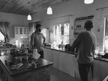 Man and woman standing in restaurant