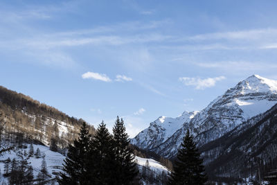 Scenic view of snowcapped mountains against sky