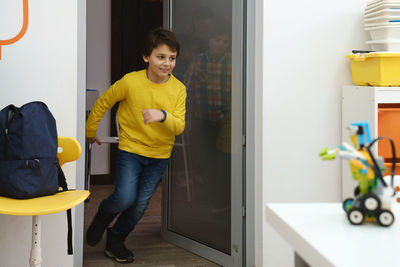 Children pupils running in school room on the brake. happy kids having fun in elementary school