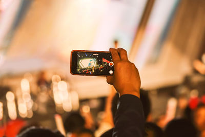 Close-up of person photographing