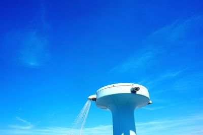 Low angle view of building against blue sky