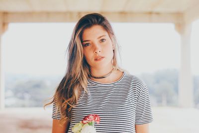 Portrait of beautiful young woman at home