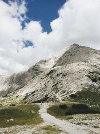 Scenic view of mountains against cloudy sky