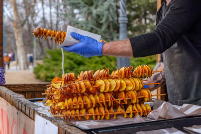 Midsection of man selling food