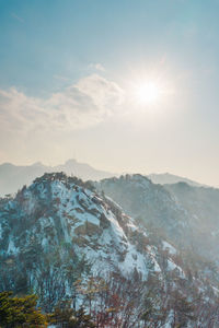 Scenic view of snowcapped mountains against sky