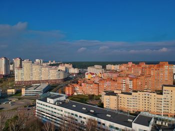 High angle view of buildings in city against sky