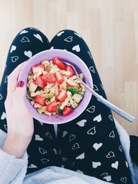 Cropped image of person eating food