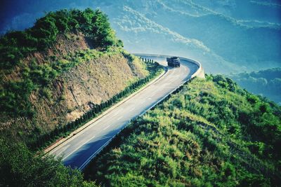 High angle view of road amidst trees in forest