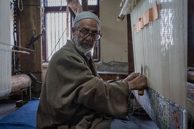 Portrait of man sitting in office