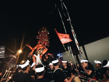 People enjoying at music concert at night