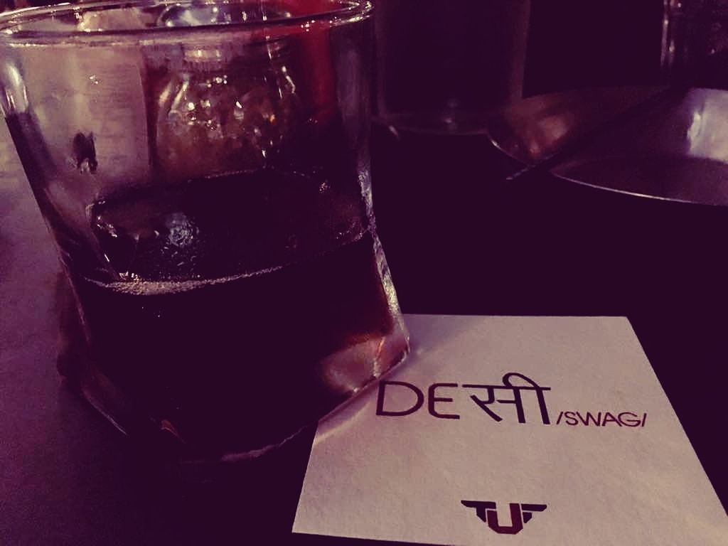 CLOSE-UP OF BEER IN GLASS ON TABLE