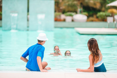 Family enjoying in swimming pool