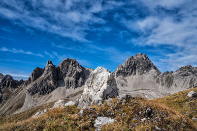 Scenic view of mountains against blue sky