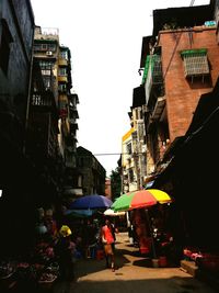 People in market against clear sky