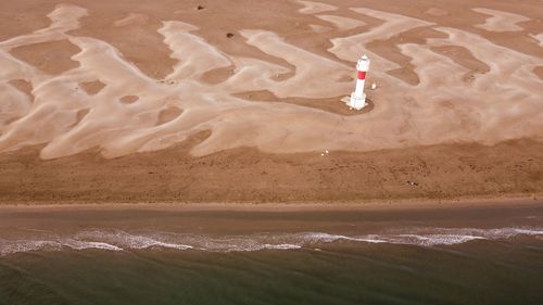 High angle view of a lighthouse on a beach