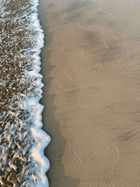 High angle view of surf on beach