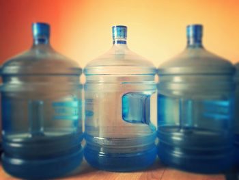 Close-up of water bottles on table