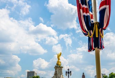 Low angle view of statue against cloudy sky