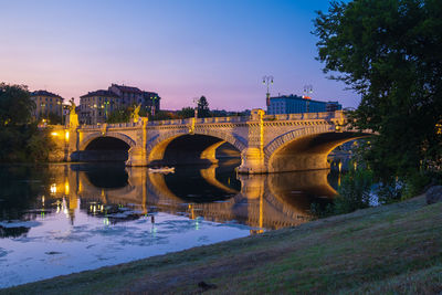 Beautiful night view of the bridge over the river po in the city of turin, italy.