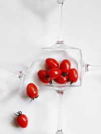 Close-up of tomatoes against white background