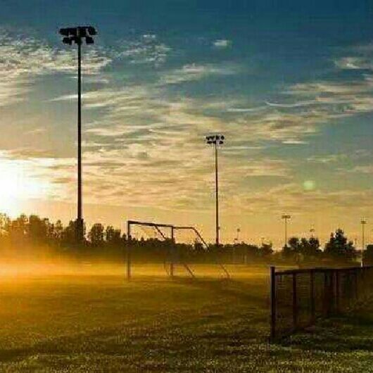 street light, sky, sunset, grass, tranquility, field, fence, tranquil scene, lighting equipment, nature, scenics, landscape, cloud - sky, tree, beauty in nature, pole, sunlight, idyllic, grassy, sun