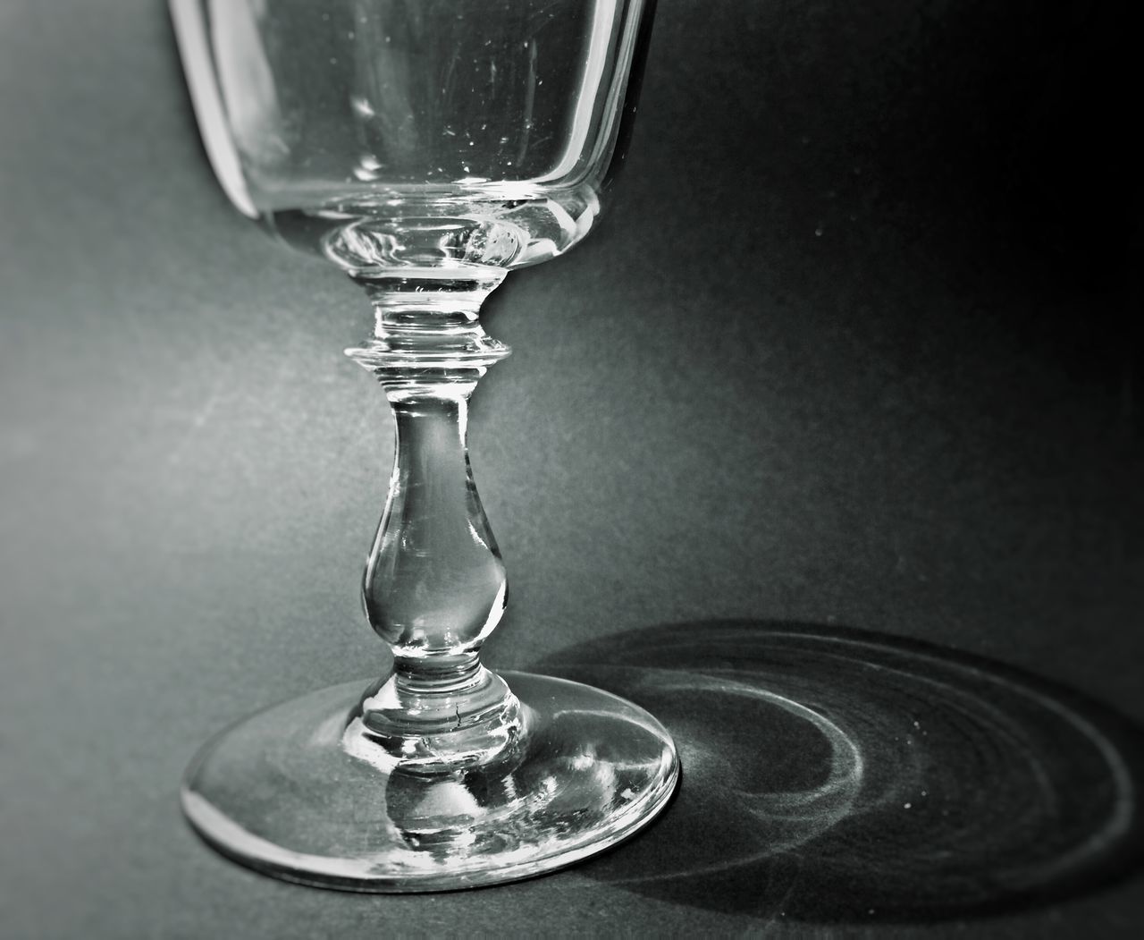 indoors, close-up, glass - material, transparent, still life, drinking glass, water, single object, reflection, wineglass, table, no people, refreshment, metal, shiny, glass, drop, studio shot, motion, focus on foreground