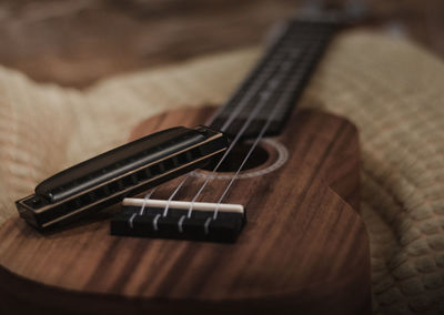 Close-up of guitar on table