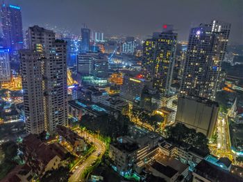High angle view of illuminated city buildings at night in malaysia