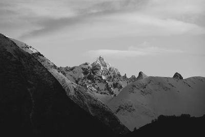 View of mountain range against cloudy sky