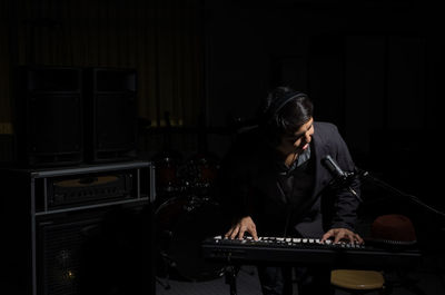 Young man playing piano