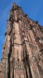 Low angle view of building against blue sky