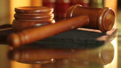 Close-up of gavel on table