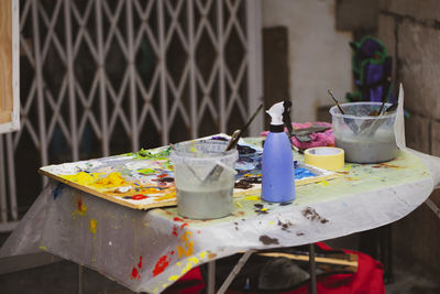 Close-up of drink on table against building