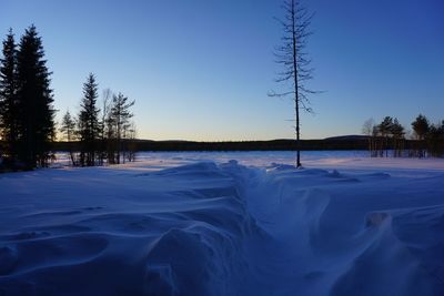 A -30 degrees  sunrise over lankojärvi lake in the middle of nowhere